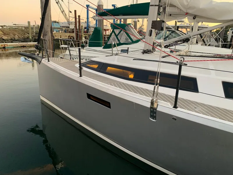 Slide: The Image of 2025 Faro Yachts 29 docked at marina, sleek design, modern features. - 2