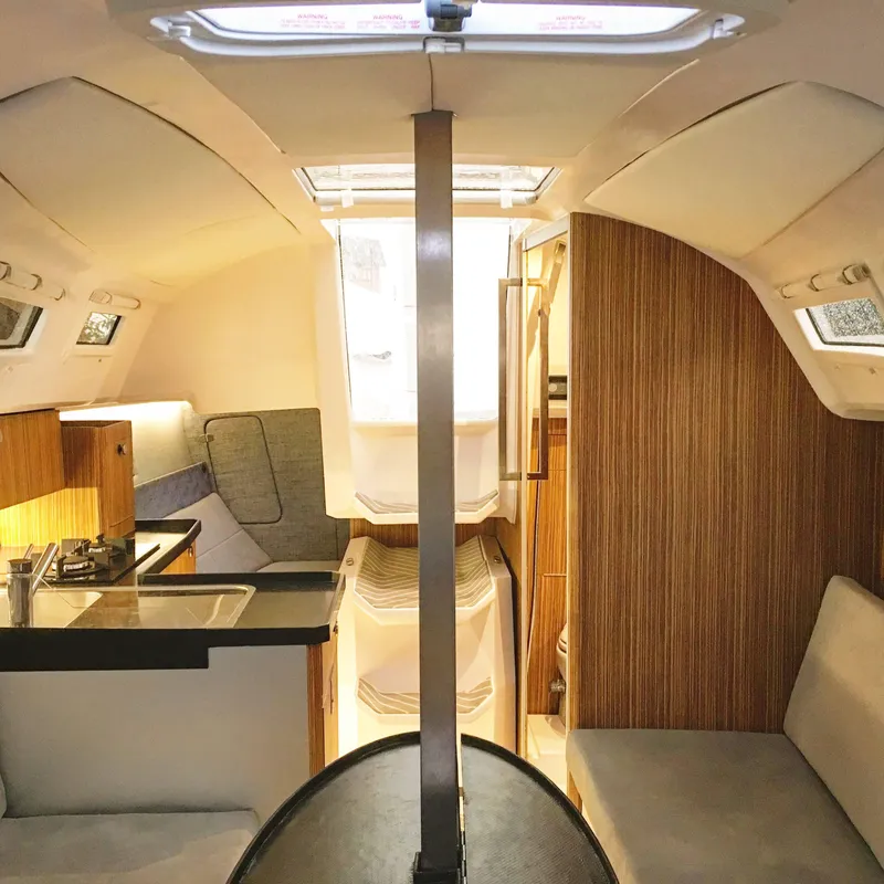 Slide: The Image of Interior of 2025 Faro Yachts 29, featuring modern design and cozy seating. - 23