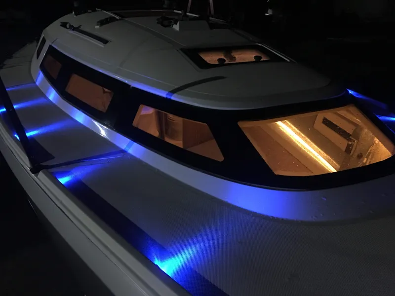 Slide: The Image of Faro Yachts 29 (2025) with illuminated blue LED lights and sleek design. - 25
