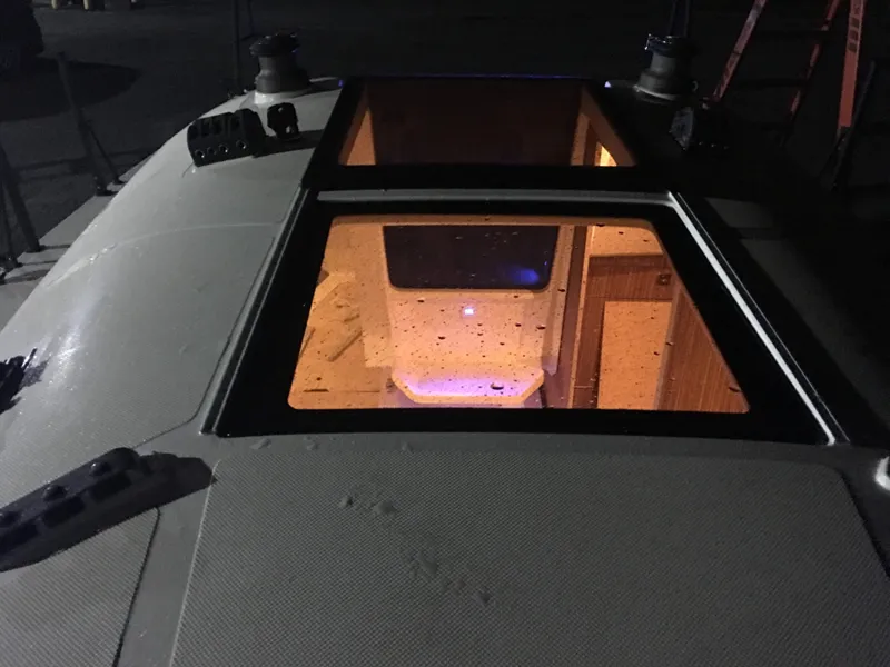 Slide: The Image of 2025 Faro Yachts 29 interior view through deck hatch at night. - 26