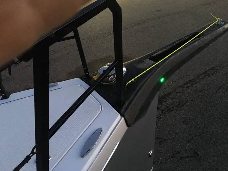 Slide: The Image of Bow of 2025 Faro Yachts 29 with green navigation light at dusk. - 32