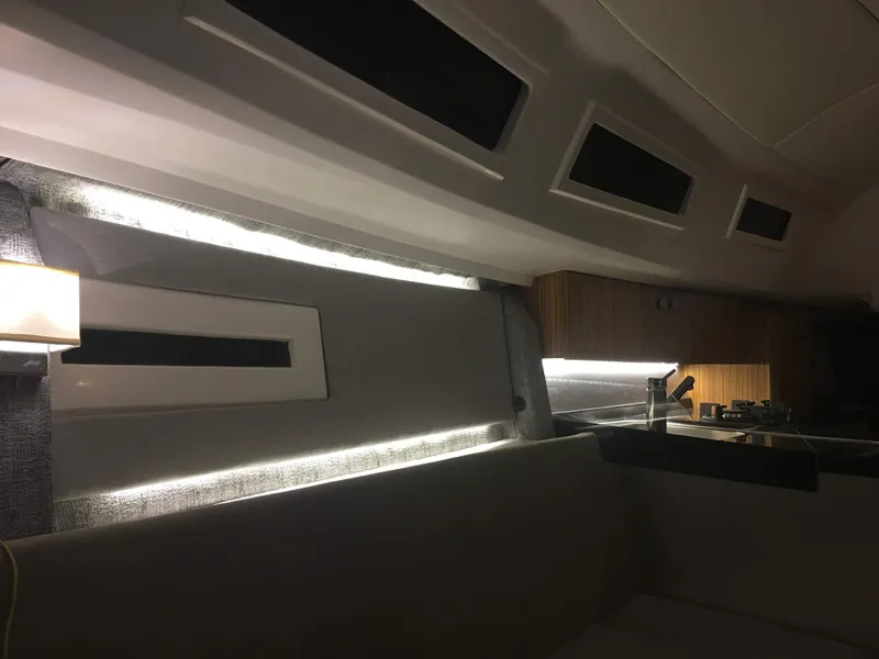 Slide: The Image of Interior of 2025 Faro Yachts 29, featuring modern lighting and sleek design elements. - 33
