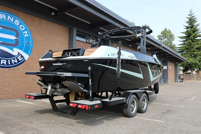 Slide: The Image of 2026 ATX Surf Boats 22 Type-S on trailer outside dealership. - 10