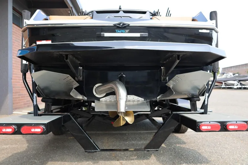 Slide: The Image of Rear view of 2026 ATX Surf Boats 22 Type-S, showcasing propeller and exhaust system. - 12