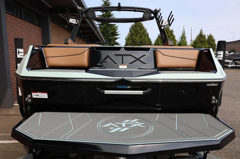 Slide: The Image of 2026 ATX Surf Boats 22 Type-S, rear view with sleek design and seating. - 13