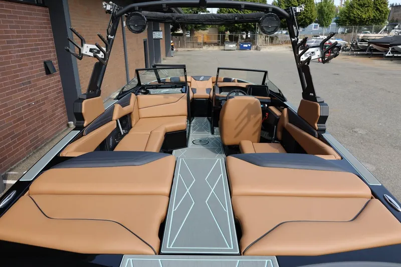 Slide: The Image of 2026 ATX Surf Boats 22 Type-S interior with tan seating and modern design. - 16