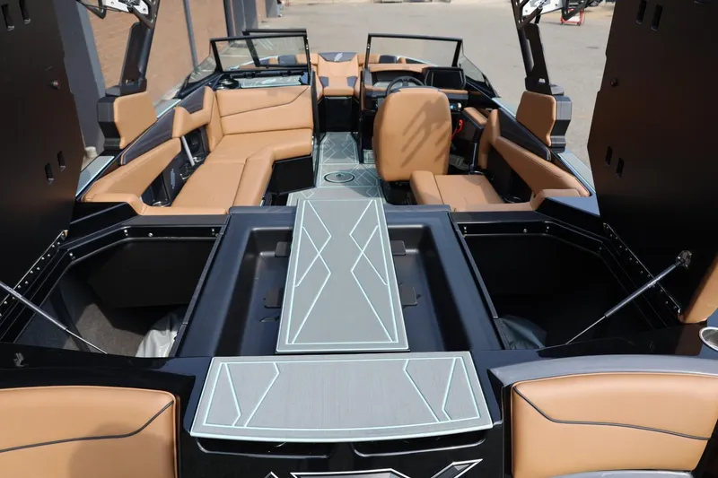Slide: The Image of 2026 ATX Surf Boats 22 Type-S interior with tan seating and modern design. - 17