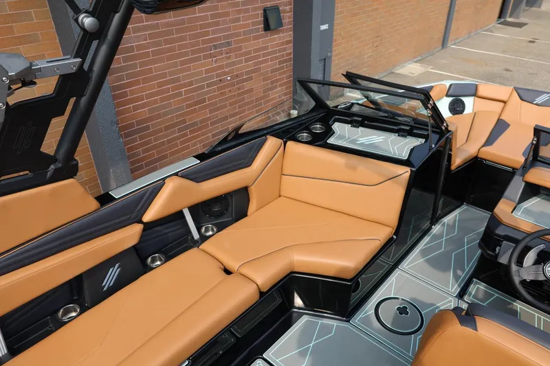 Slide: The Image of 2026 ATX Surf Boats 22 Type-S interior with tan seating and modern design. - 19