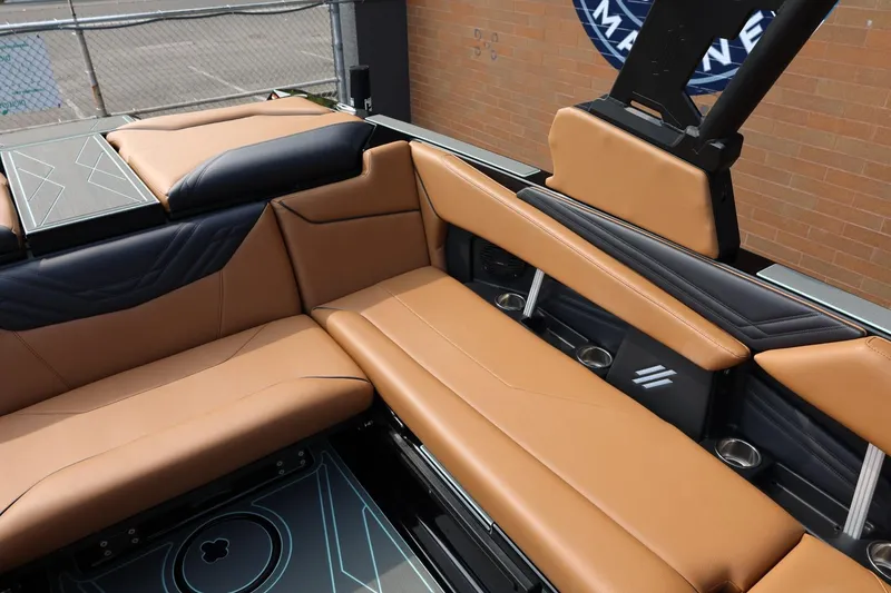 Slide: The Image of Luxurious interior of 2026 ATX Surf Boats 22 Type-S with tan and black seating. - 21