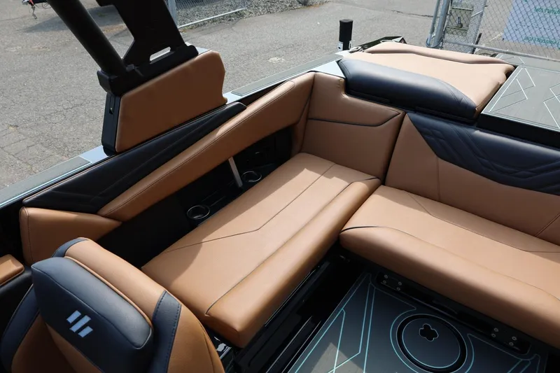 Slide: The Image of Luxurious interior of 2026 ATX Surf Boats 22 Type-S with tan and black seating. - 22