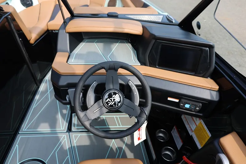 Slide: The Image of 2026 ATX Surf Boats 22 Type-S dashboard with modern steering and touchscreen display. - 23