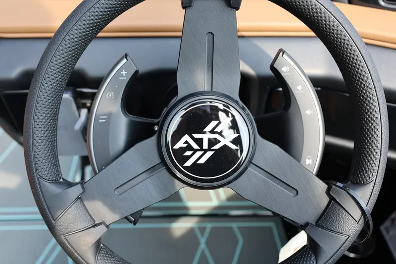 Slide: The Image of Steering wheel of 2026 ATX Surf Boats 22 Type-S with control buttons. - 24