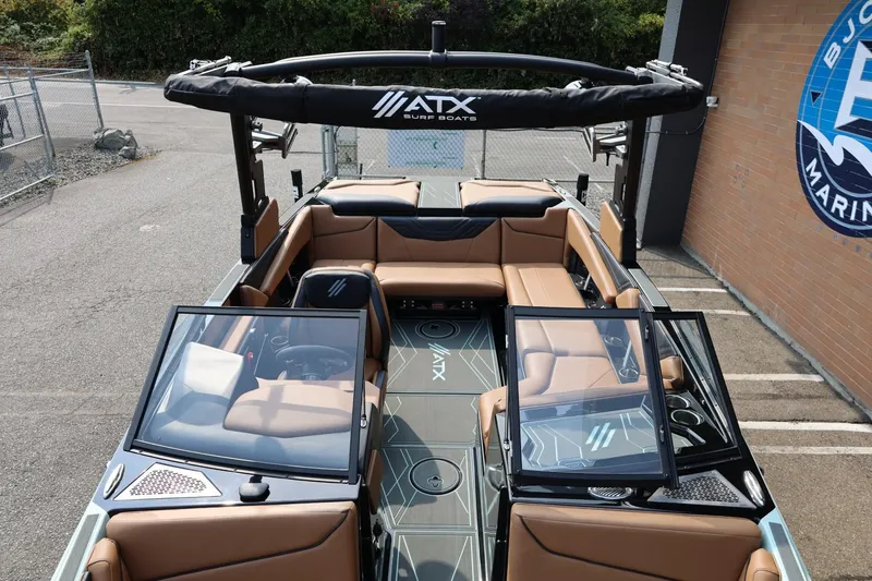 Slide: The Image of 2026 ATX Surf Boats 22 Type-S interior with tan seating and open windshield. - 31