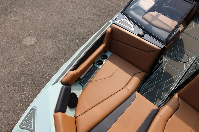 Slide: The Image of 2026 ATX Surf Boats 22 Type-S interior with tan and black seating, cup holders, and sleek design. - 32
