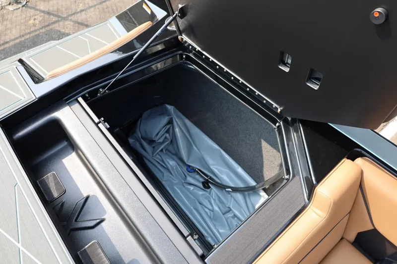 Slide: The Image of 2026 ATX Surf Boats 22 Type-S storage compartment with open lid and interior view. - 39