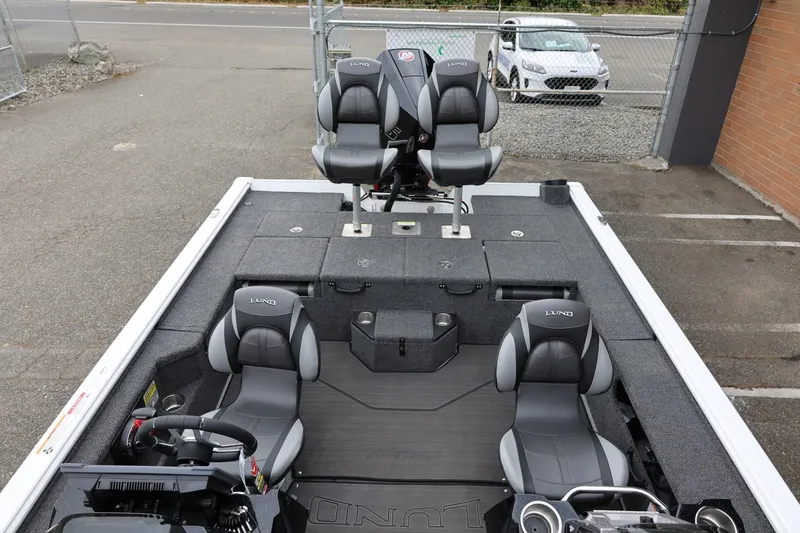 Slide: The Image of 2026 Lund 2075 Pro-V Bass XS boat interior with four seats and steering wheel. - 14