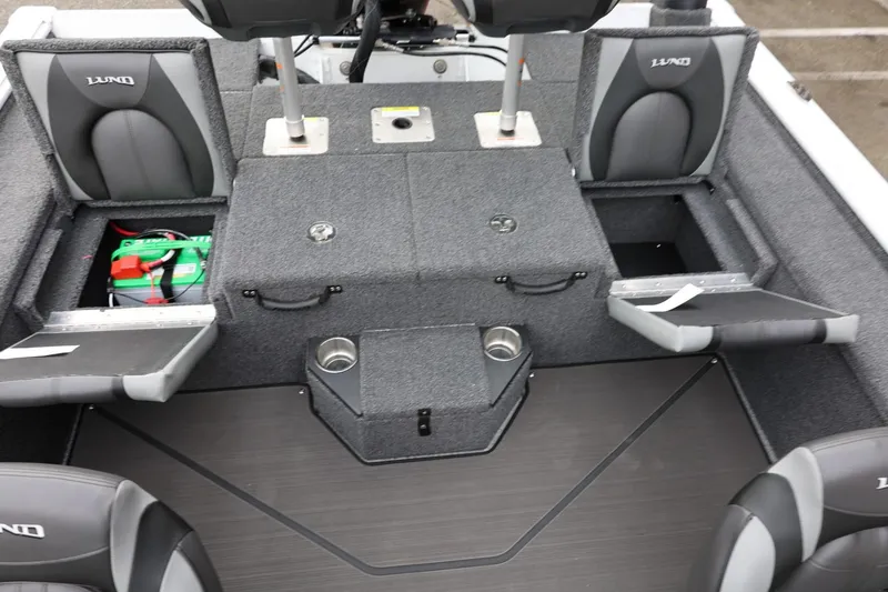 Slide: The Image of 2026 Lund 2075 Pro-V Bass XS boat interior with storage compartments and seating. - 16