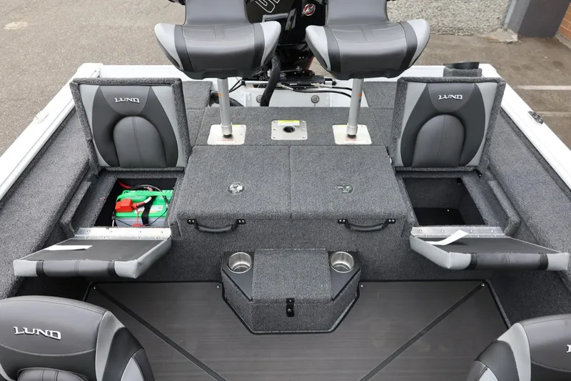 Slide: The Image of 2026 Lund 2075 Pro-V Bass XS boat interior with storage compartments and seating. - 17