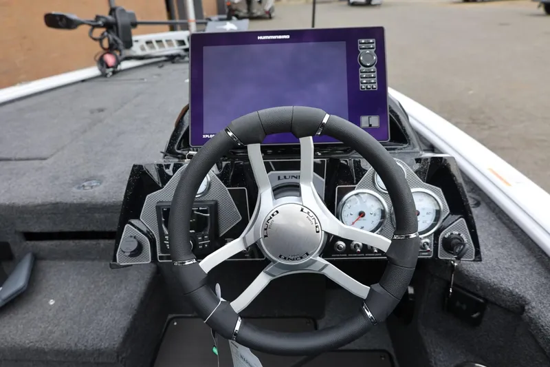 Slide: The Image of Steering console of 2026 Lund 2075 Pro-V Bass XS with modern controls and display. - 21