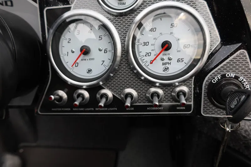 Slide: The Image of Dashboard of 2026 Lund 2075 Pro-V Bass XS with gauges and control switches. - 23