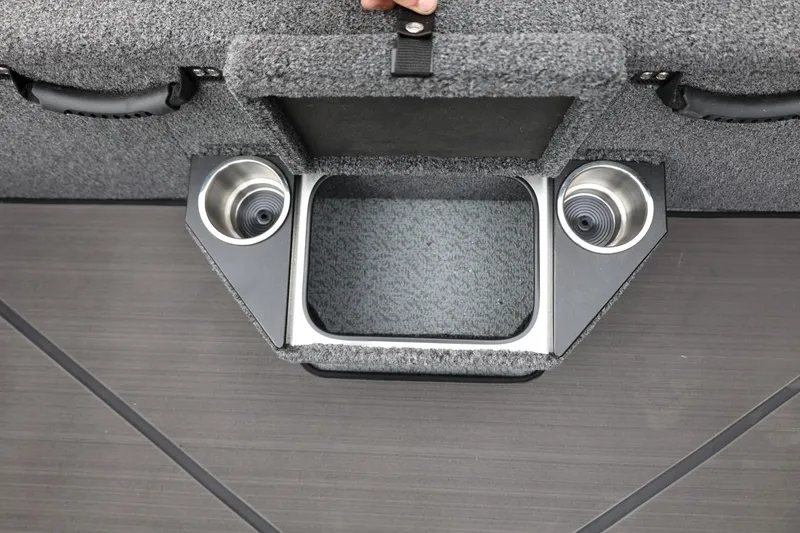 Slide: The Image of 2026 Lund 2075 Pro-V Bass XS boat interior with cup holders and storage compartment. - 28