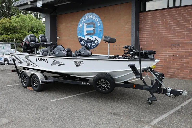 Slide: The Image of 2026 Lund 2075 Pro-V Bass XS boat on trailer at Bjornson Marine. - 3
