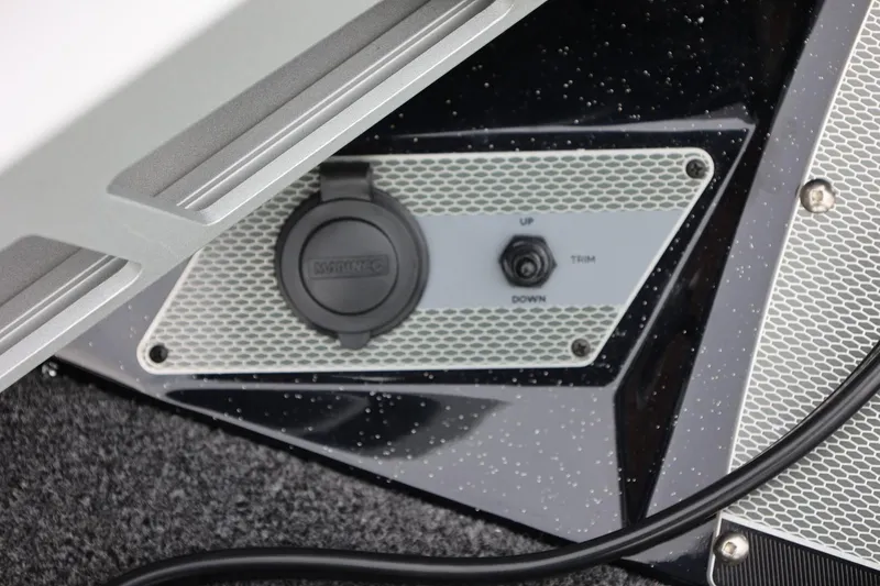 Slide: The Image of Control panel on a 2026 Lund 2075 Pro-V Bass XS boat, featuring trim adjustment. - 42