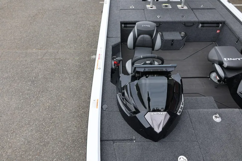 Slide: The Image of 2026 Lund 2075 Pro-V Bass XS boat interior with sleek design and modern seating. - 45
