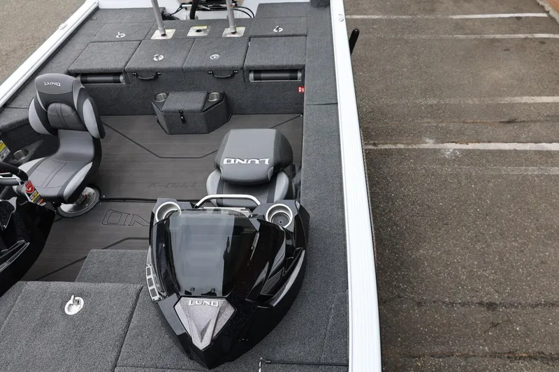 Slide: The Image of 2026 Lund 2075 Pro-V Bass XS boat interior with seating and storage compartments. - 46