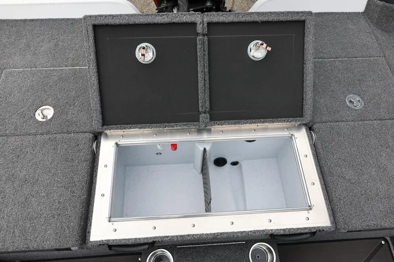 Slide: The Image of 2026 Lund 2075 Pro-V Bass XS livewell compartment with open lids, showcasing interior storage. - 47