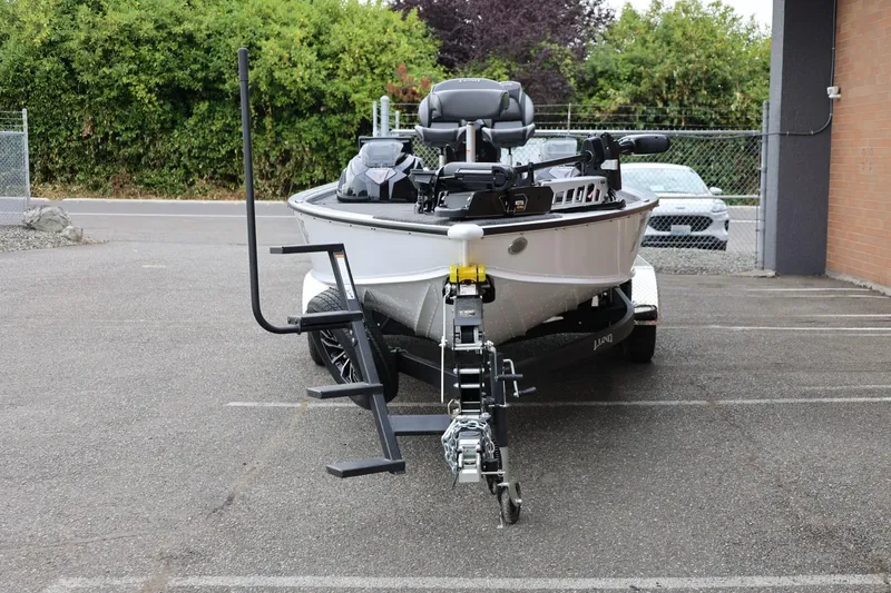 Slide: The Image of 2026 Lund 2075 Pro-V Bass XS boat on trailer in parking lot. - 5