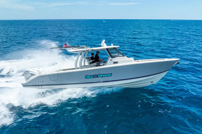 Slide: The Image of 2024 Pursuit S 358 Sport boat cruising on open ocean waters. - 16