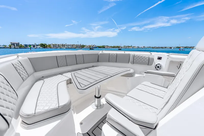Slide: The Image of Luxurious seating area on 2024 Pursuit S 358 Sport boat with ocean view. - 24