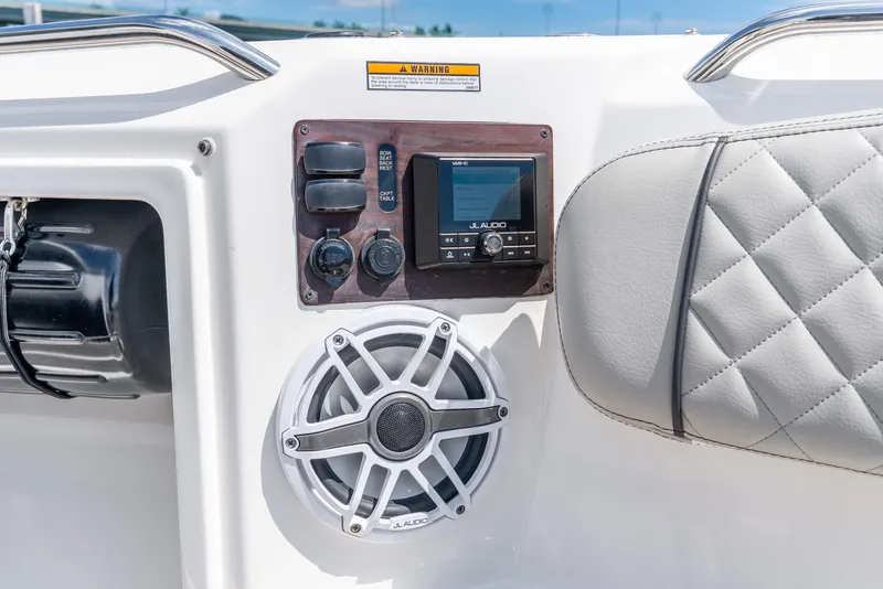 Slide: The Image of Control panel of 2024 Pursuit S 358 Sport boat with JL Audio system. - 25