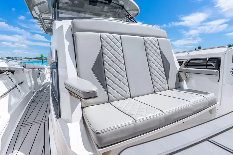Slide: The Image of 2024 Pursuit S 358 Sport boat with luxurious seating and sleek design. - 28