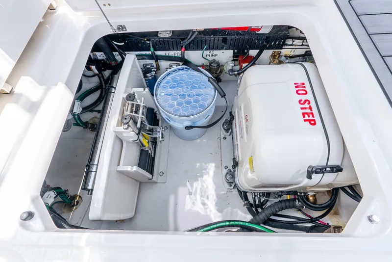 Slide: The Image of 2024 Pursuit S 358 Sport engine compartment with equipment and wiring. - 32