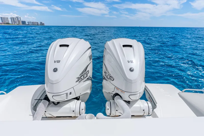 Slide: The Image of 2024 Pursuit S 358 Sport boat with twin Yamaha V8 outboard engines on blue ocean. - 37