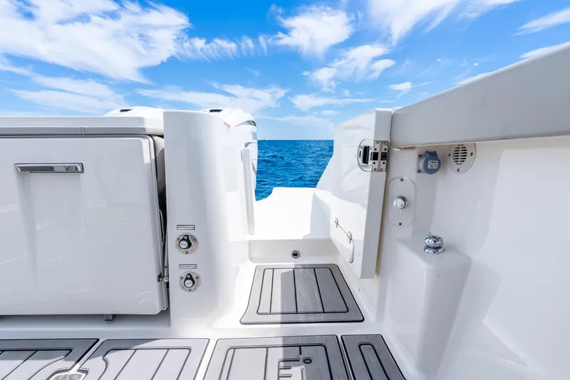 Slide: The Image of 2024 Pursuit S 358 Sport boat deck with ocean view and blue sky. - 41