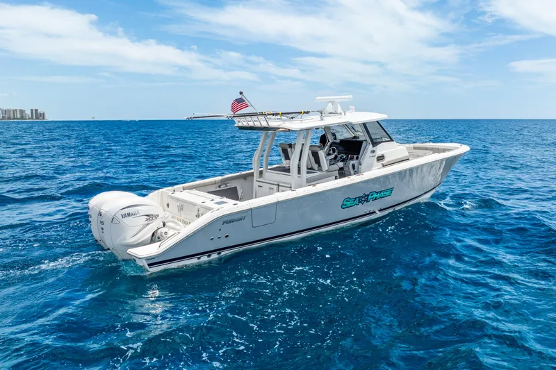 Slide: The Image of 2024 Pursuit S 358 Sport boat cruising on open blue ocean waters. - 6