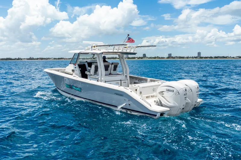 Slide: The Image of 2024 Pursuit S 358 Sport boat cruising on blue ocean under a clear sky. - 8