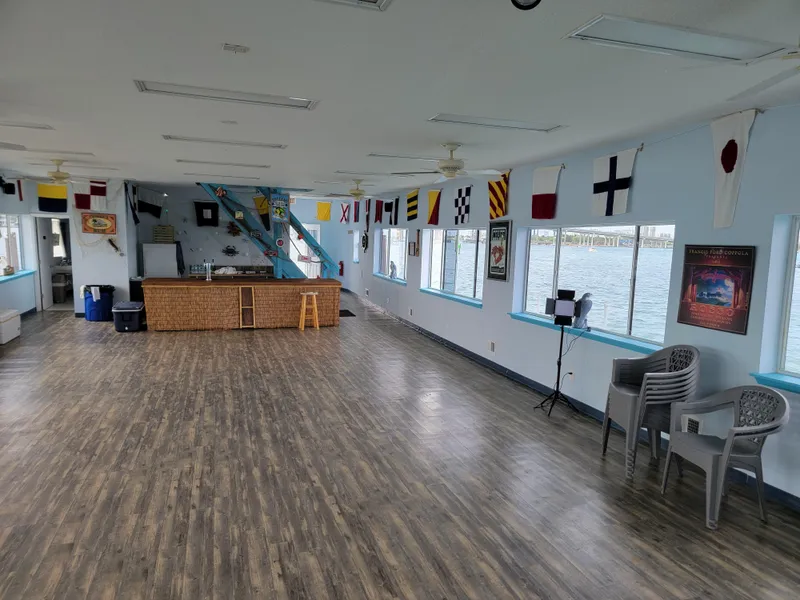 Slide: The Image of Spacious interior of a 2003 custom floating home with nautical decor and waterfront views. - 15