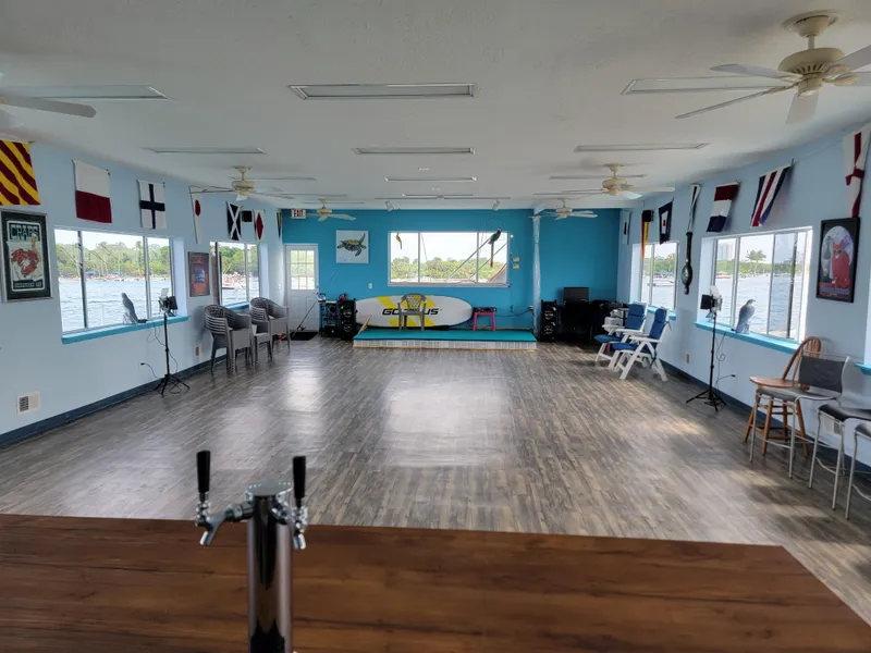 Slide: The Image of Spacious interior of a 2003 custom floating home with nautical decor and large windows. - 18