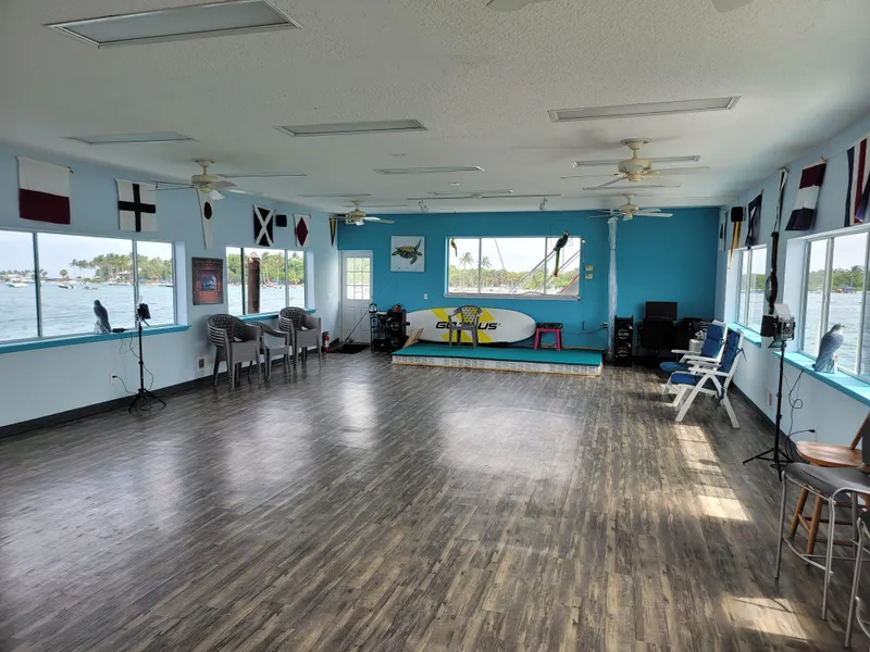 Slide: The Image of Spacious interior of a 2003 custom floating home with large windows and nautical decor. - 19