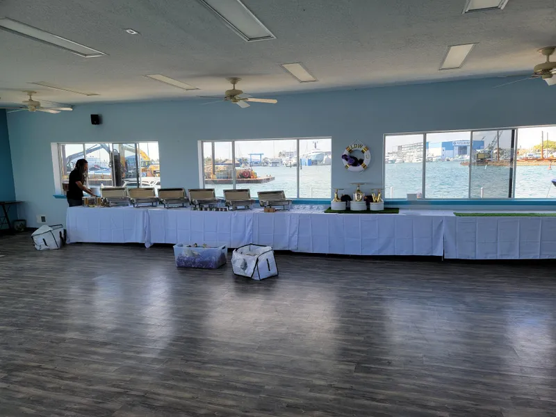 Slide: The Image of Floating home interior with buffet setup, overlooking waterfront through large windows. - 29