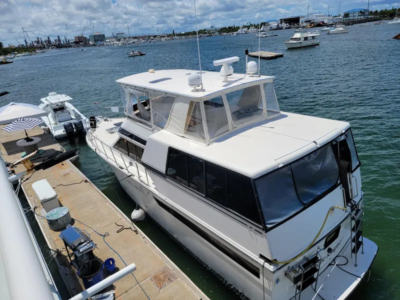 Slide: The Image of Custom 2003 floating home docked at marina, surrounded by calm waters and other boats. - 38