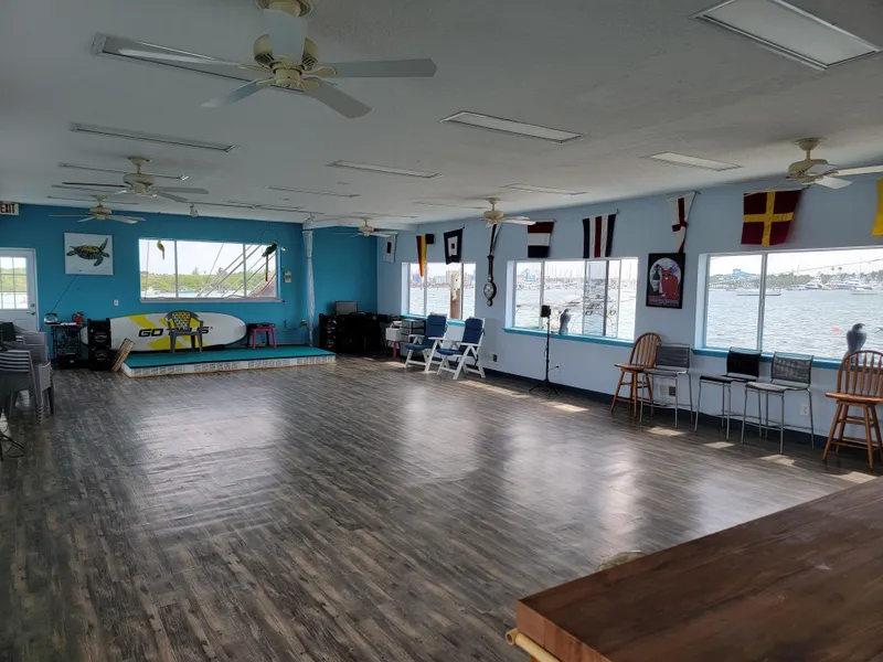 Slide: The Image of Spacious interior of a 2003 custom floating home with large windows and nautical decor. - 5