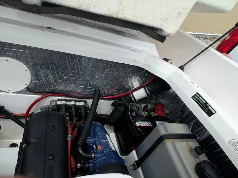 Slide: The Image of Engine compartment of a 2003 Yamaha Boats 210LX, showing wiring and components. - 17