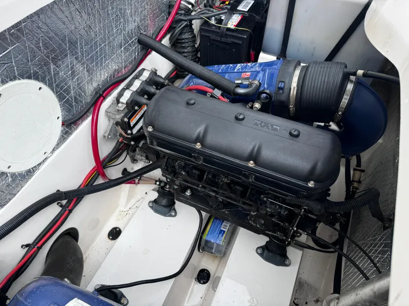 Slide: The Image of Engine compartment of a 2003 Yamaha Boats 210LX, showcasing detailed components and wiring. - 15