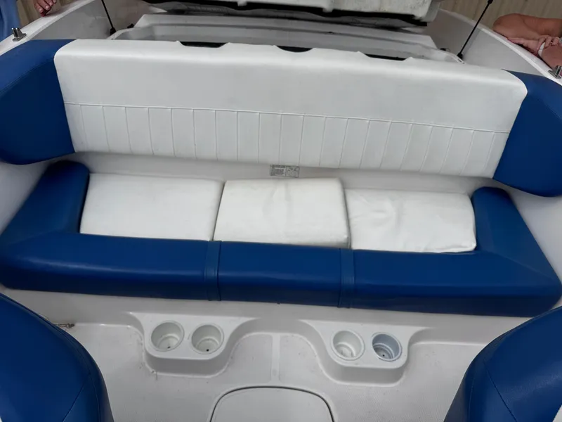 Slide: The Image of 2003 Yamaha Boats 210LX interior seating with blue and white upholstery. - 9