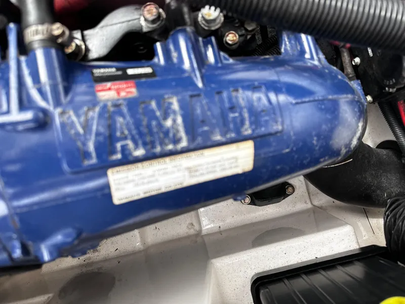Slide: The Image of Close-up of a 2003 Yamaha Boats 210LX engine component. - 11